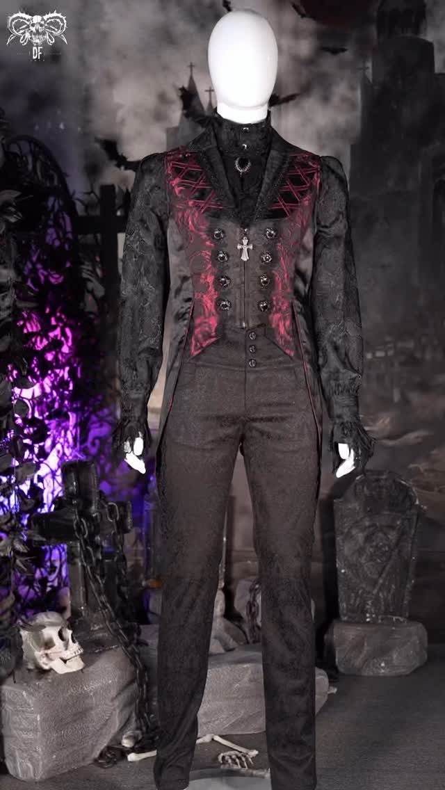 Mannequin wearing a Victorian-style black waistcoat and high-waisted trousers in a graveyard setting.